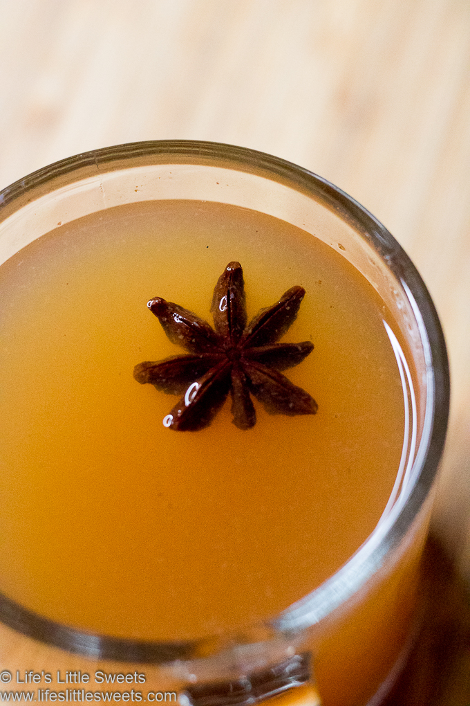 Hot Mulled Cider (Wassail) in a clear mug with star anise