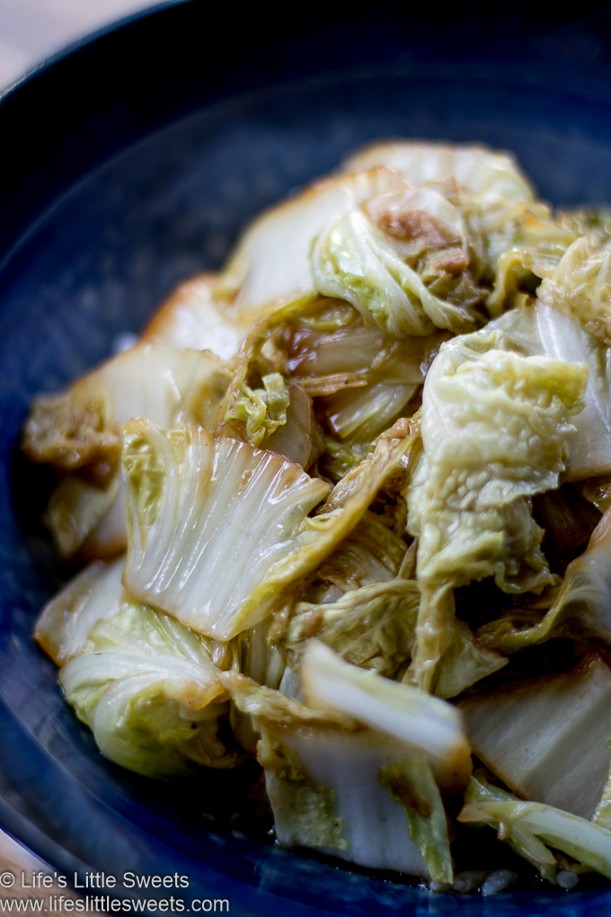 Stir-Fried Napa Cabbage in a blue bowl over steamed rice