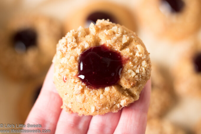 one of Grandma’s Perfect Jam Thumbprint Cookies in a hand