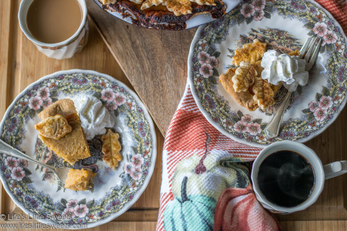 Homemade pumpkin pie slices on plates served with fresh, hot, black coffee