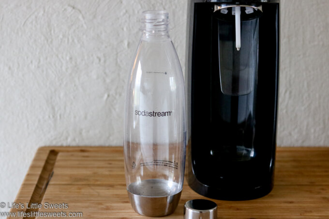 Sodastream and bottle on a table 