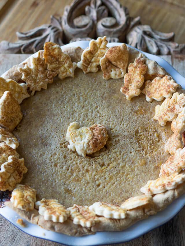 a pumpkin pie decorated for Thanksgiving featuring pie crust cookies
