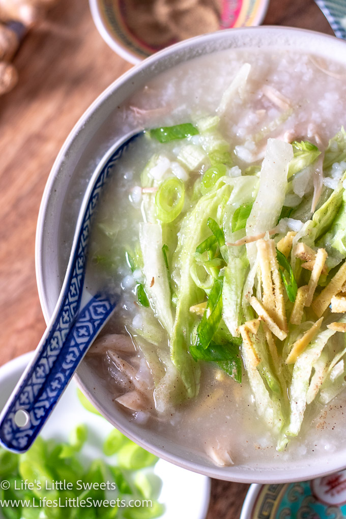 Congee Recipe with ginger, scallions and shredded iceberg lettuce with a spoon