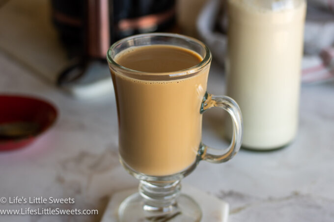 a coffee with hazelnut cream in a clear coffee mug