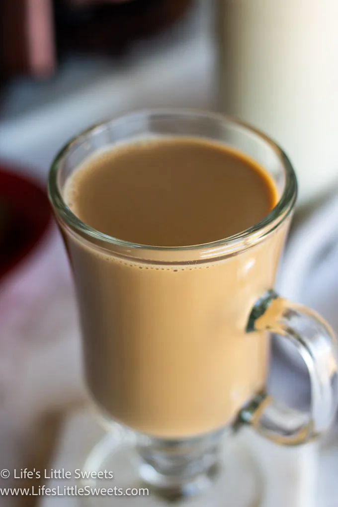 coffee with cream in an Irish coffee mug  with a marble background