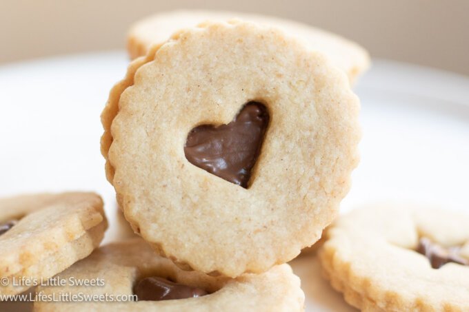 Nutella Linzer cookies on a white plate