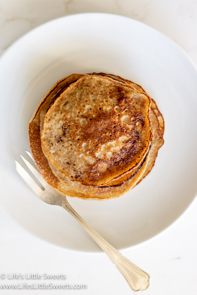 an overhead view of pancakes on a plate