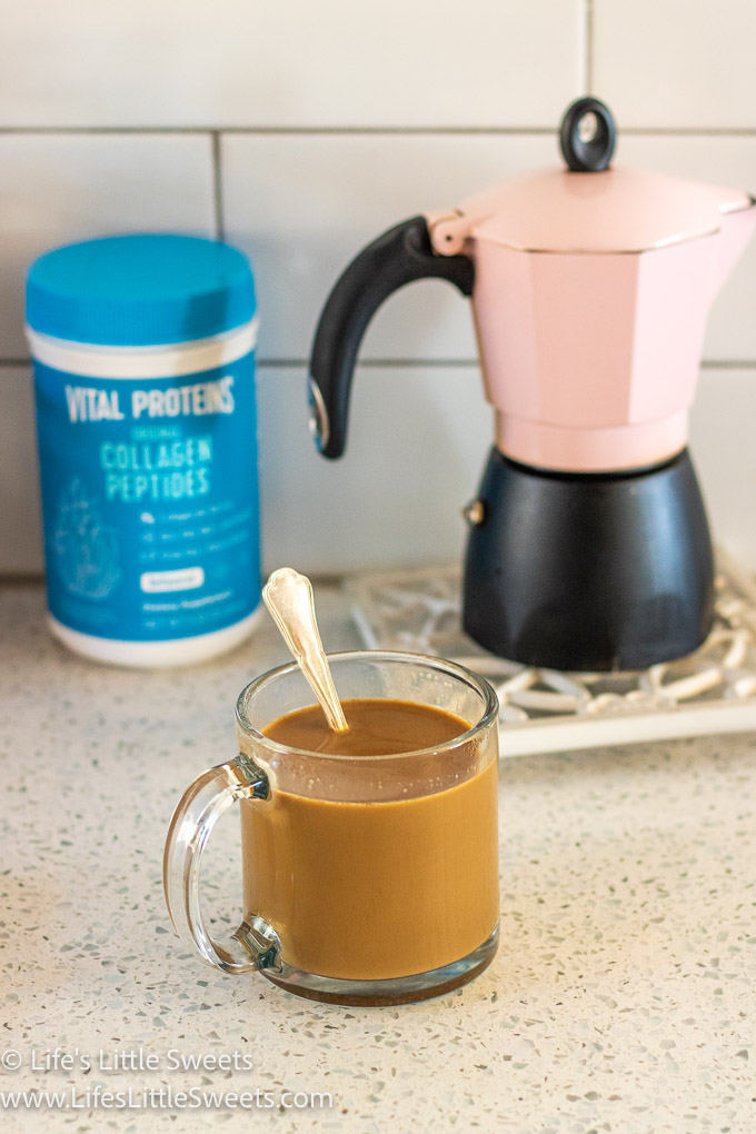a clear glass mug filled with coffee and a stovetop espresso maker and a blue bottle of Vital Proteins in the background
