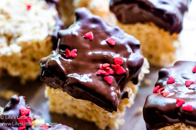 Chocolate-Dipped Rice Krispies Treats on wax paper