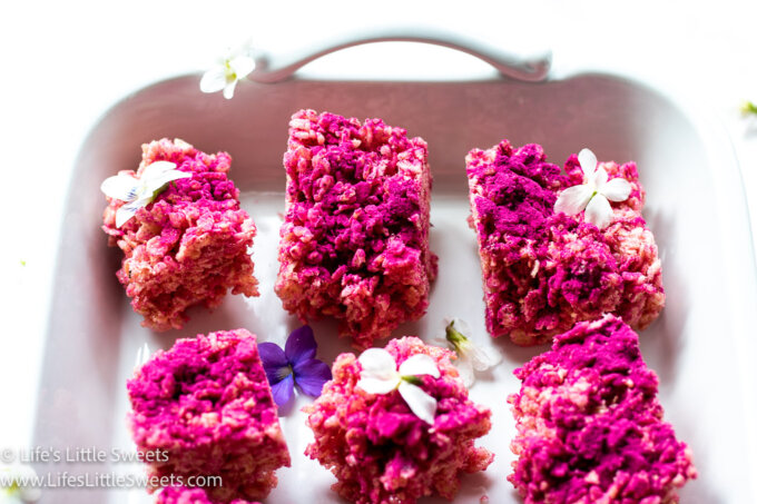 pink rice Krispies treats with flowers in a white platter