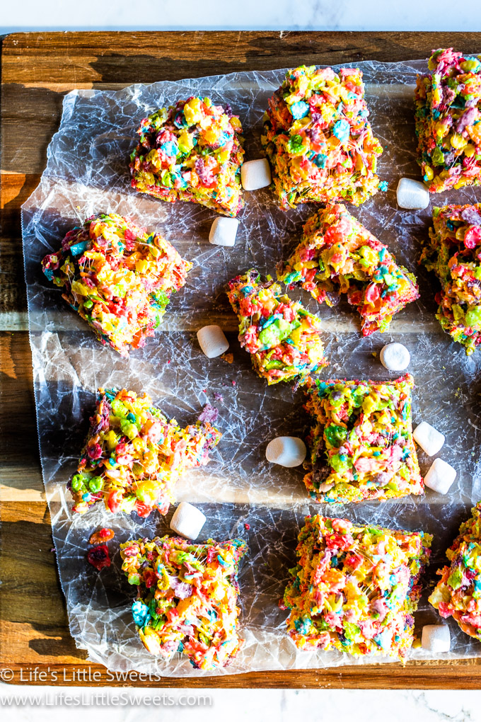 Fruity Pebbles Treats on wax paper in afternoon light with mini-marshmallows