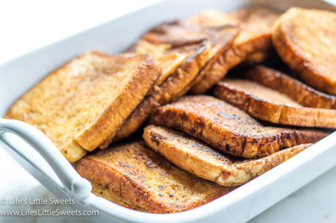 a white platter of French toast with a white background