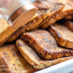 sprinkling French toast slices with cocoa-cinnamon sugar mixture 