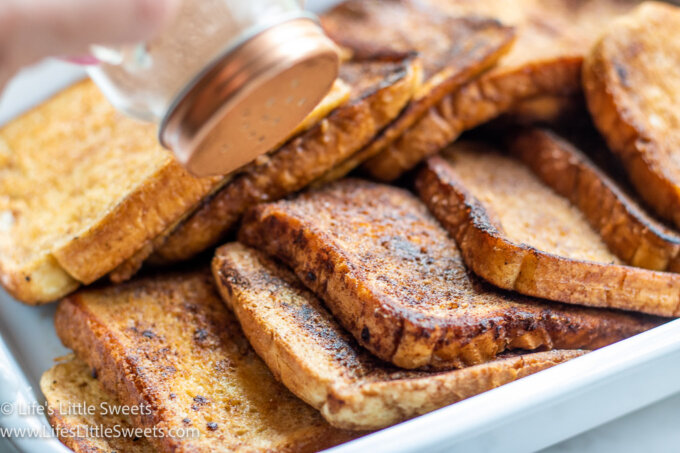 sprinkling cinnamon-sugar mixture over French toast