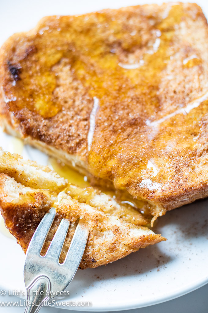 Cocoa Cinnamon French Toast close up with a white background and a fork