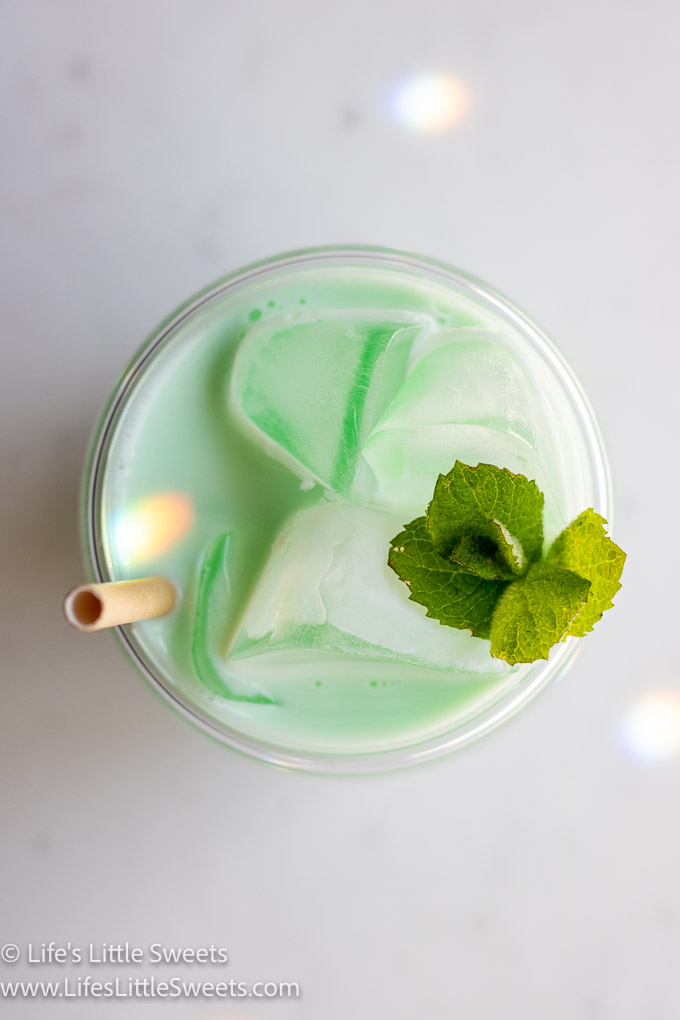 overhead view of green milk with a mint sprig