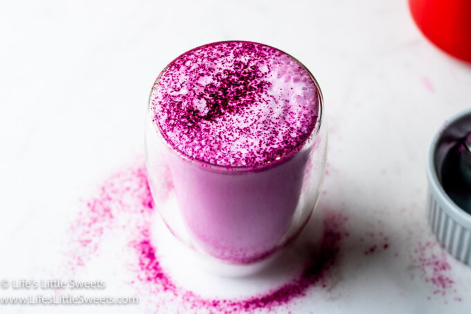 Dragon Fruit Steamed Milk on a marble