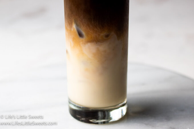the bottom half of a Iced Almond Milk Latte