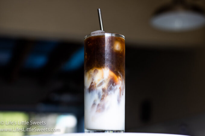 Iced Coffee with Almond Milk on a marble counter in a modern kitchen