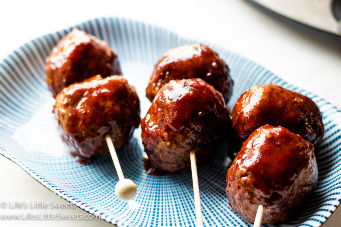 skewered meatballs on a serving dish 