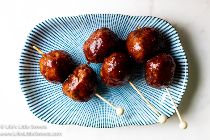 skewered meatballs on a serving dish