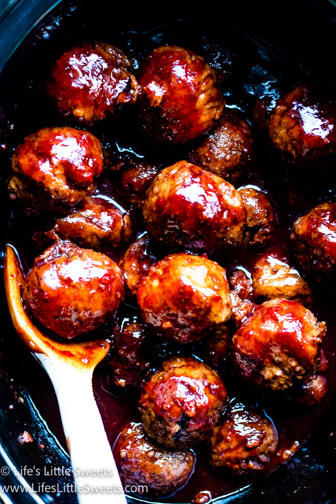 meatballs in a crockpot with red-purple sauce