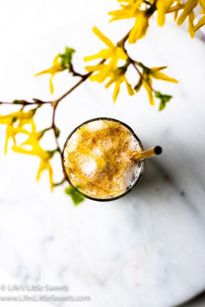 foamy iced coffee with yellow flowers