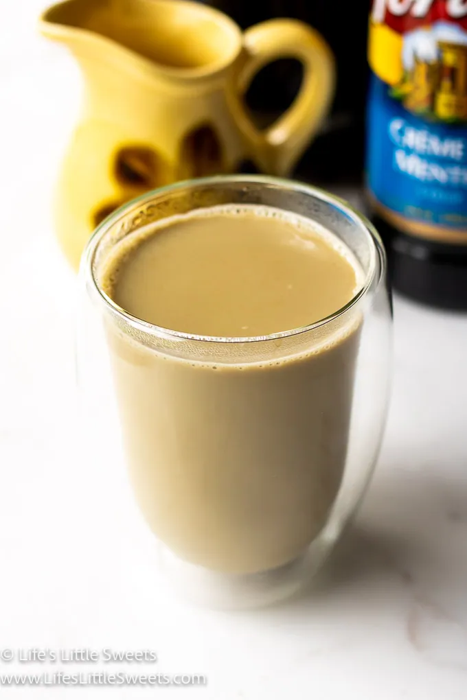 coffee in a double walled glass mug vertical photo