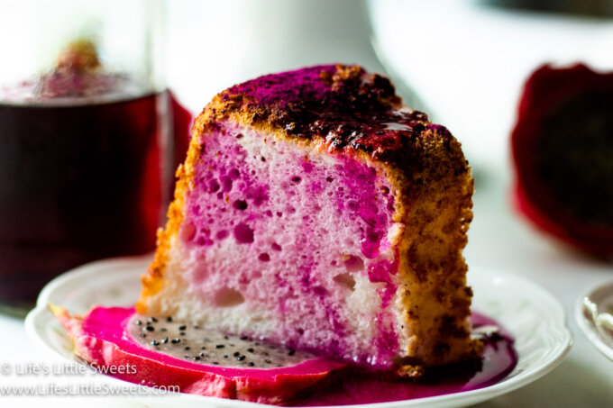 Dragon Fruit Angel Food Cake on a plate with red simple syrup