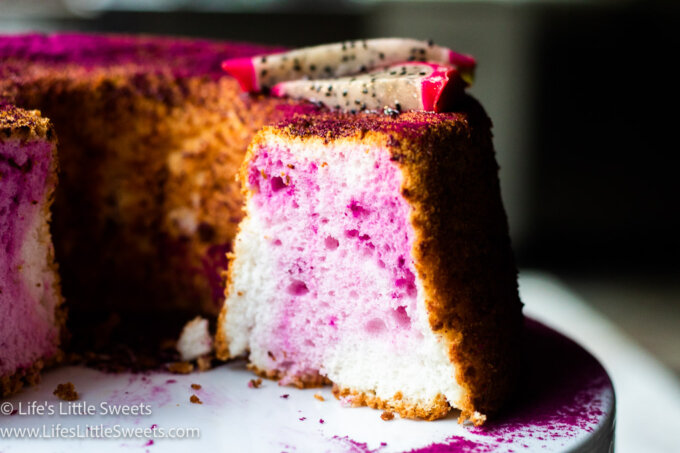 pink and white angel food cake with dragon fruit slices on top
