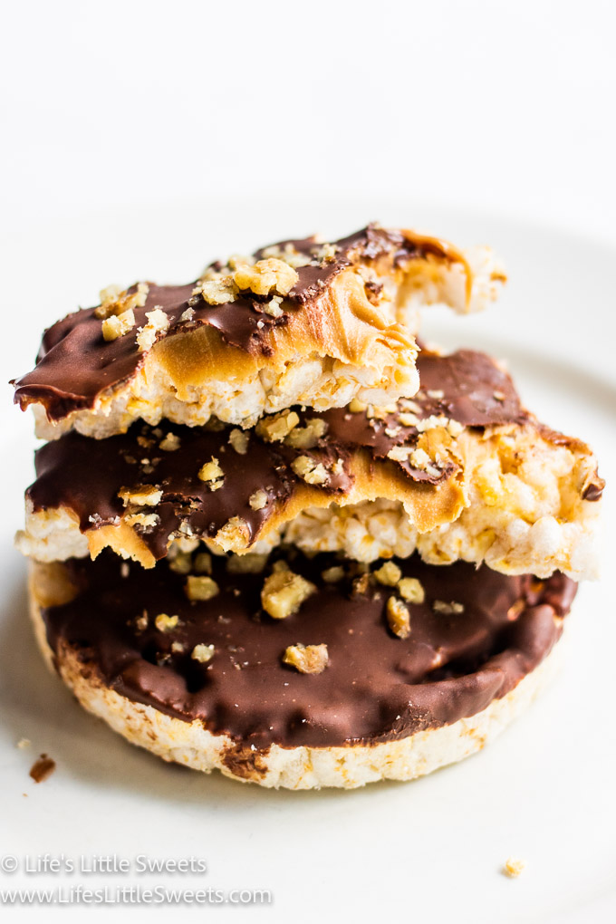 Chocolate Peanut Butter Rice Cakes broken in half and stacked in a white kitchen