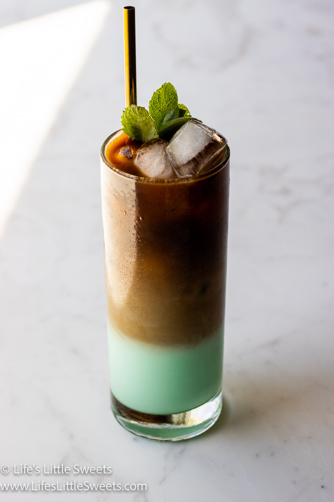 green cold coffee and mint on a white and gray marble counter