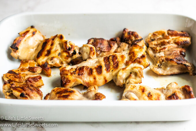 grilled chicken in a white dish