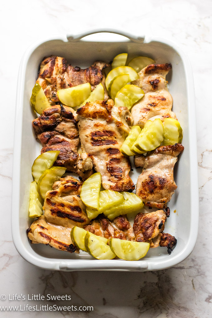 green pickles with grilled chicken in a white dish