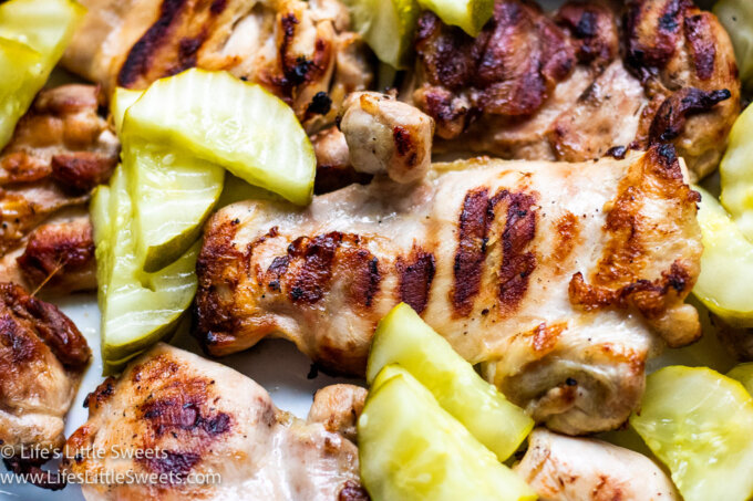 green pickles with grilled chicken in a white dish