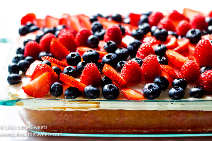 a 9x13-inch pan of cake with berries