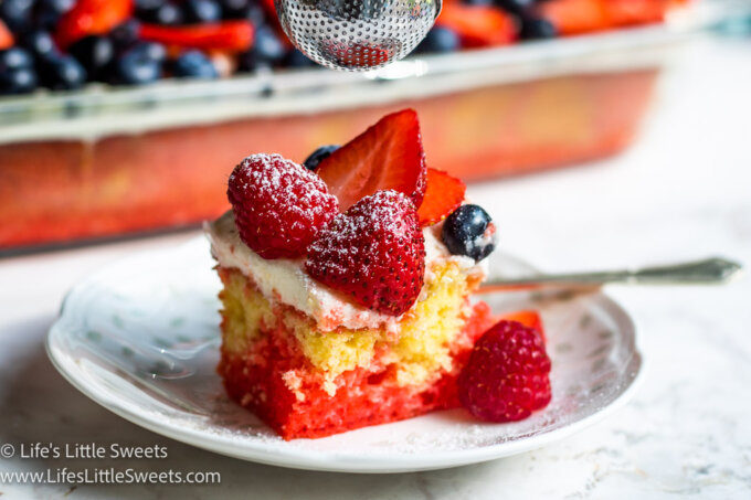 a slice of cake with berries