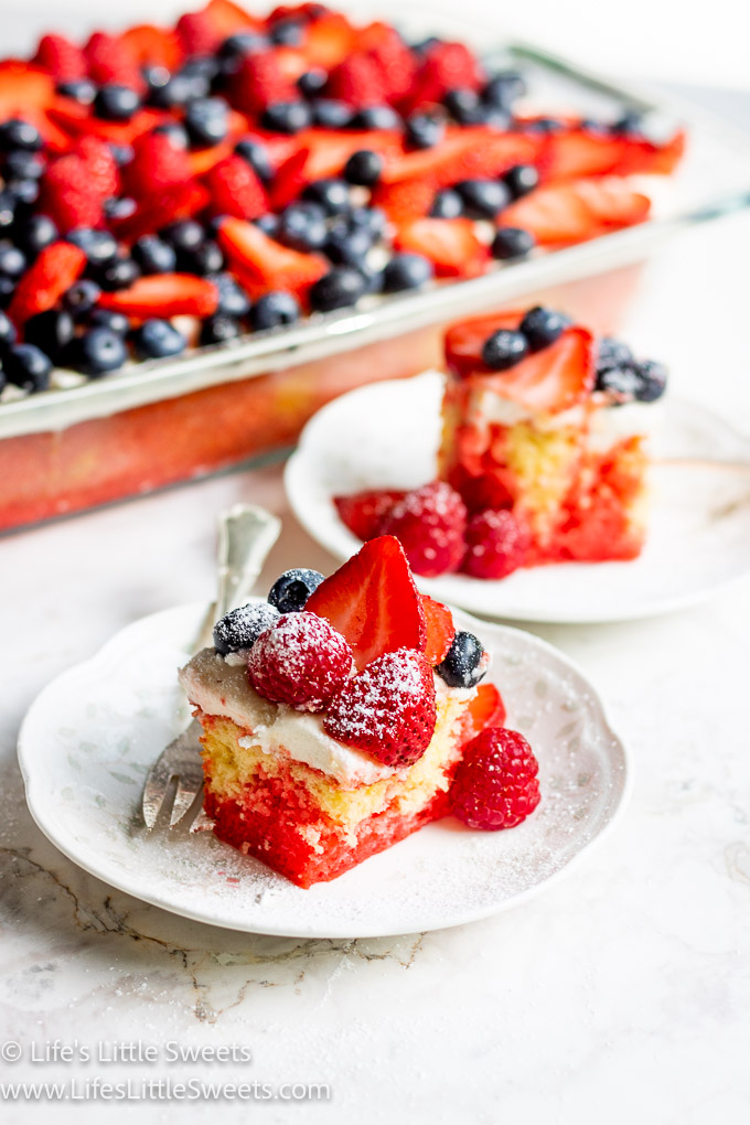 a 9x13-inch pan of cake with berries with cake slices