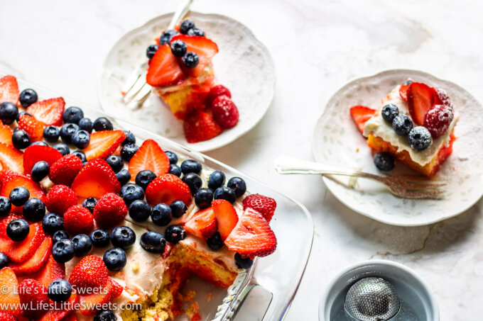 cake with berries on a plate over a marble surface