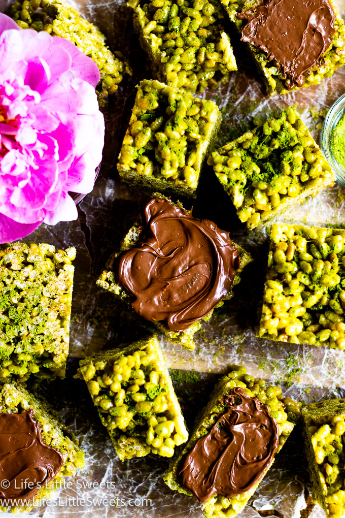 squares of Matcha Rice Krispie Treats with chocolate and a pink peony