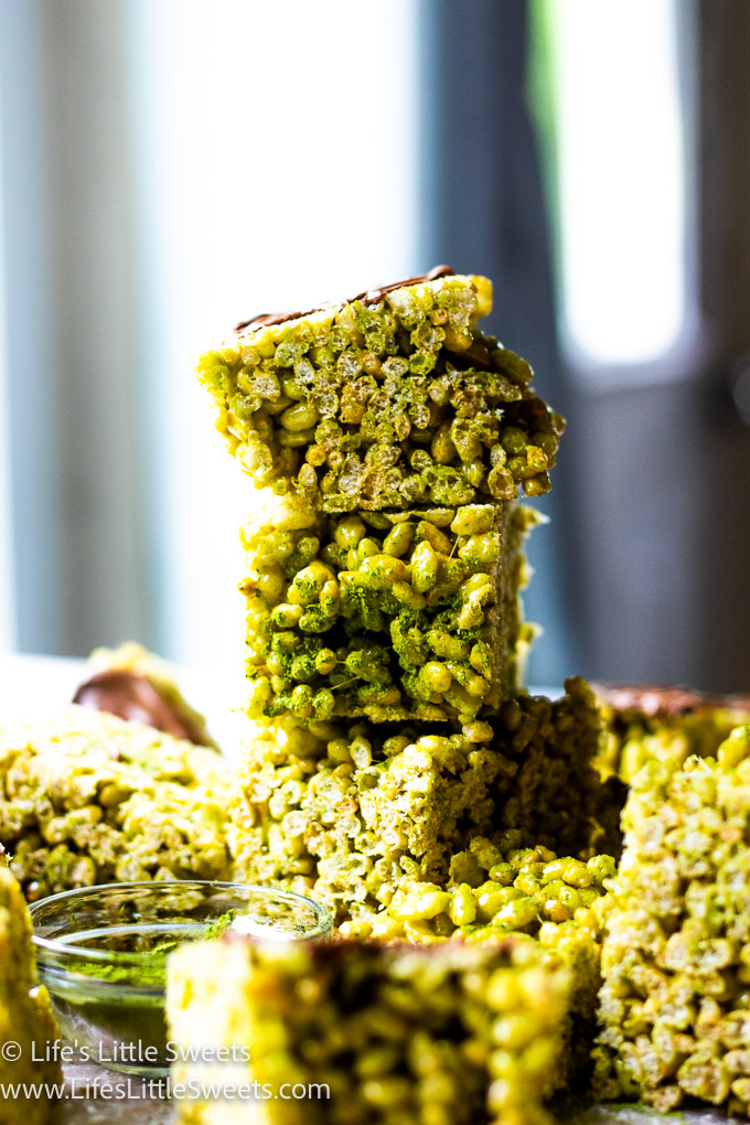Matcha Rice Krispie Treats stacked high with chocolate