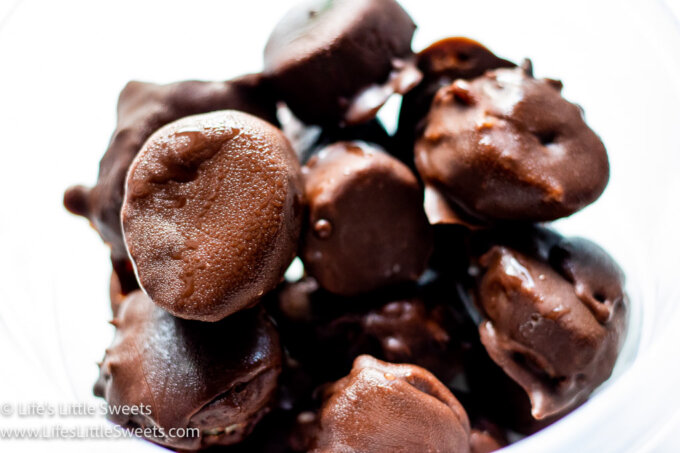 chocolate-covered frozen banana slice in a bowl