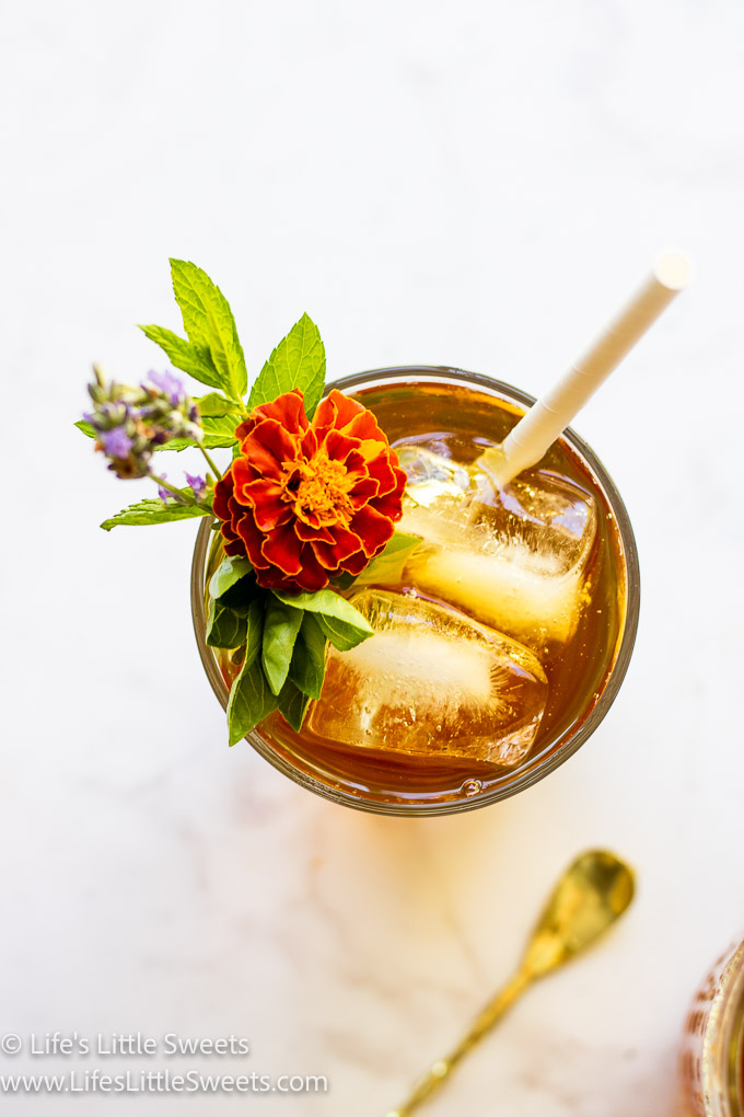 flowers in a clear glass with iced tea