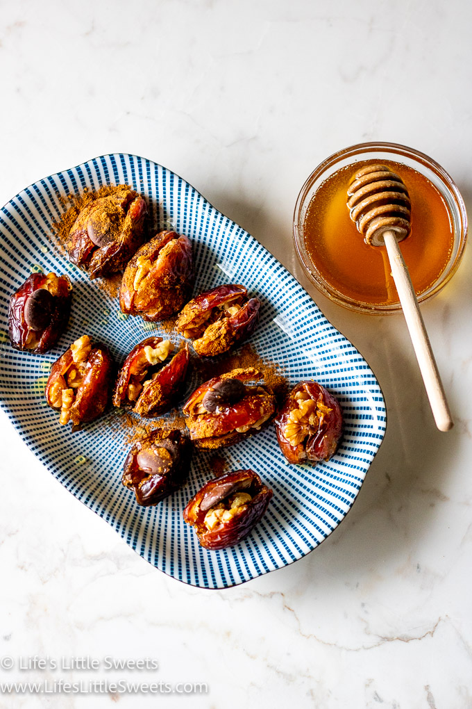 stuffed dates on a plate with honey