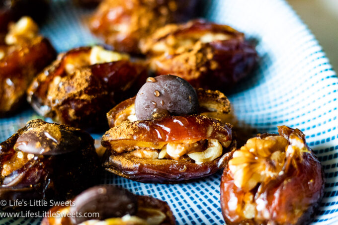 stuffed dates on a plate with honey