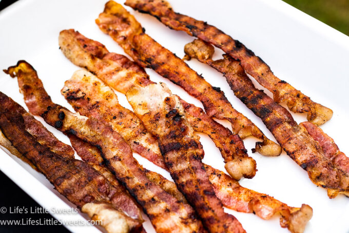 grilled bacon on a white platter outside