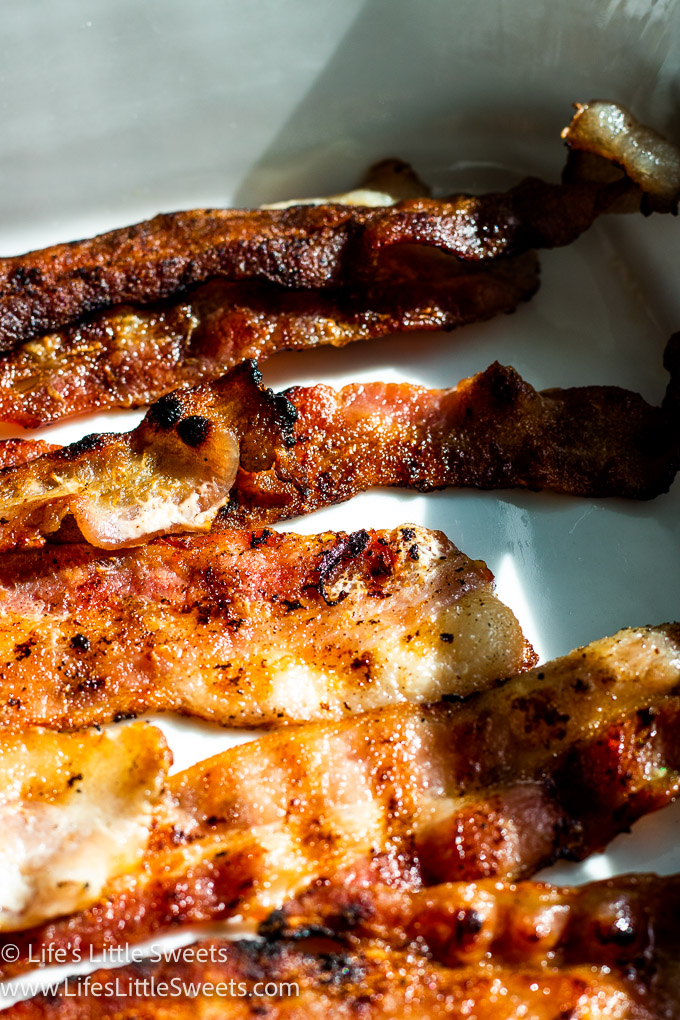close up of bacon on a white plate
