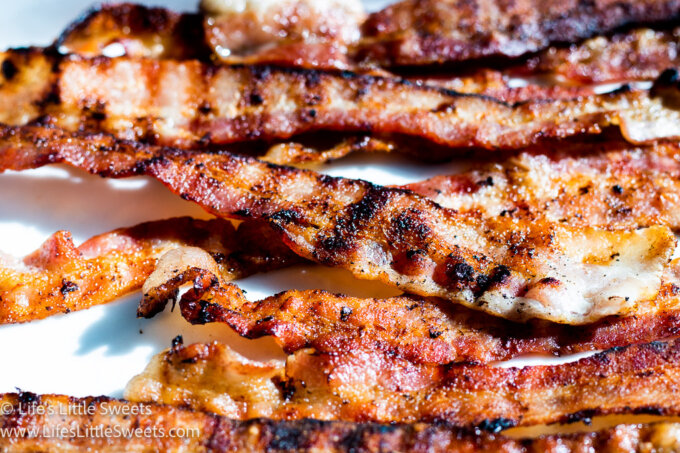grilled bacon on a white surface
