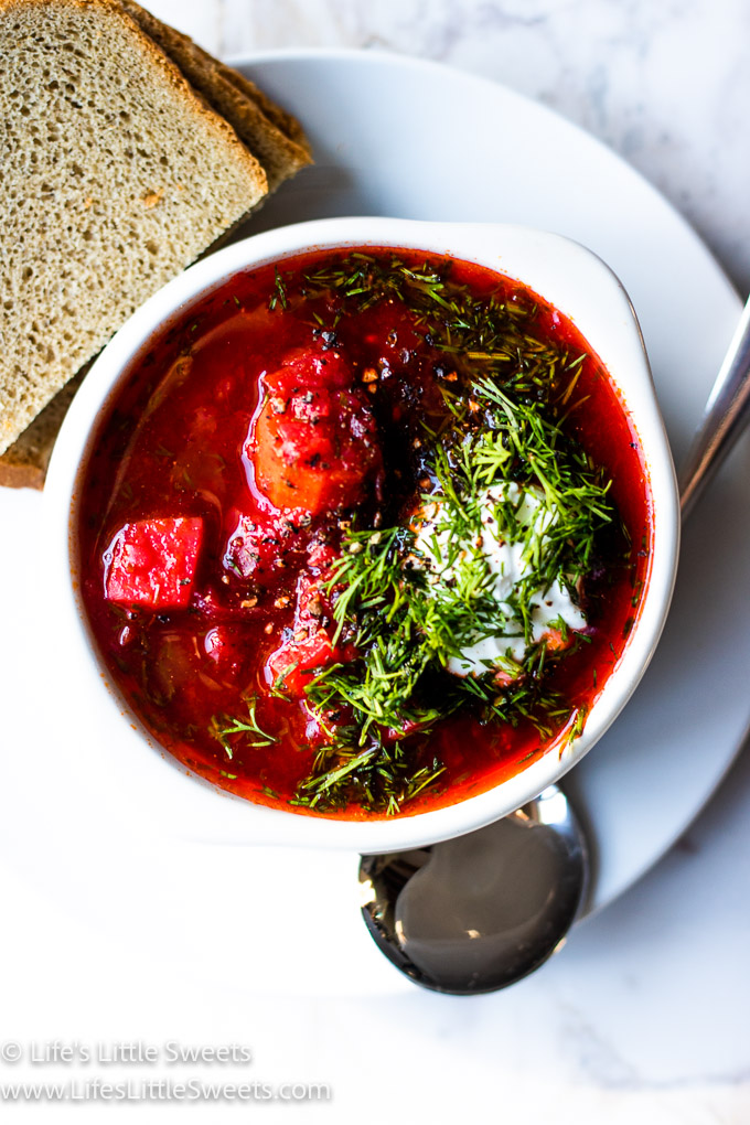 red Borscht soup with dill and sour cream over head