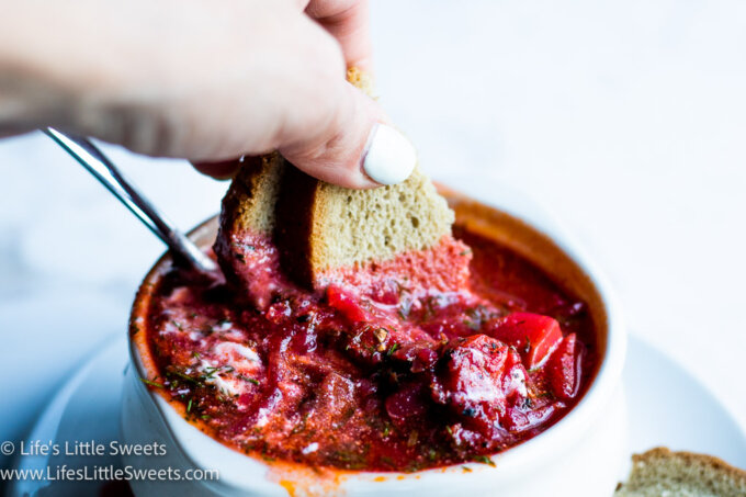 red Borscht soup with dill and sour cream with rye bread